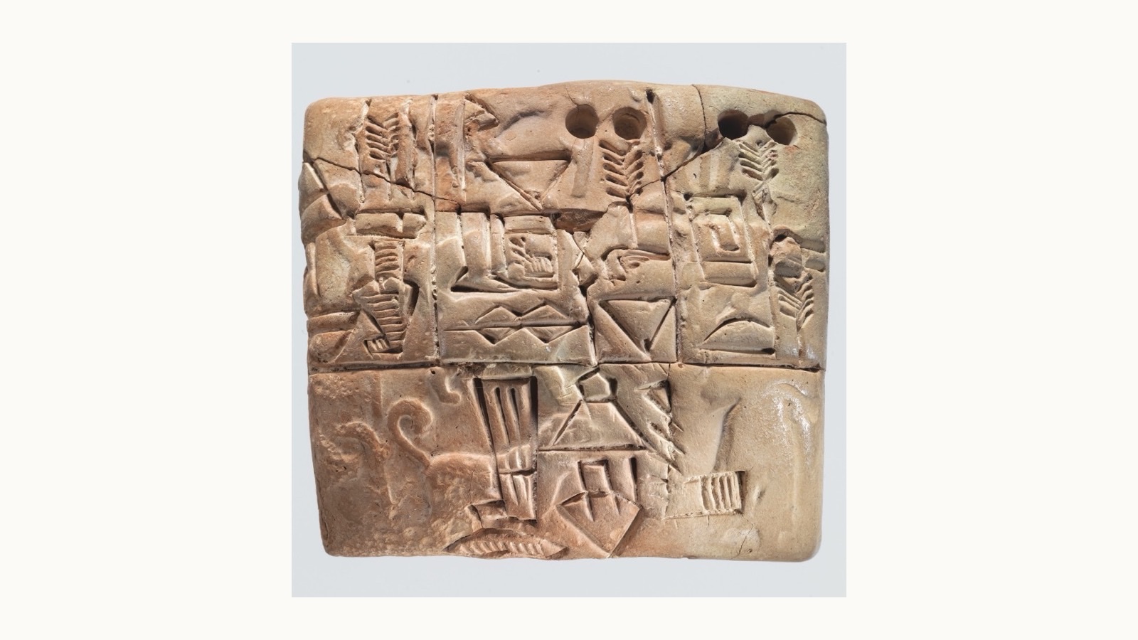 A Mesopotamian clay tablet covered in dense cuneiform script, an ancient administrative record of the kind used to track debts, rations, and obligations in the temple economies of Sumer